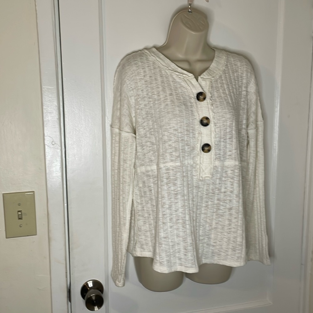 Maurice’s beige sweater